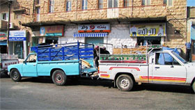 Moving the tent from one truck to another for delivery