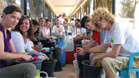 Washing pottery in camp