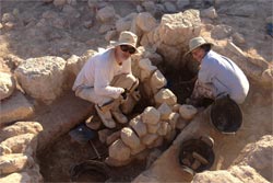 Larry Murrin and Carolyn excavating the broad room in Field H